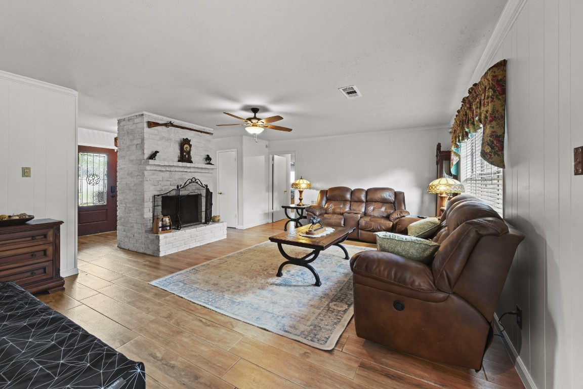 13823 Wickersham Lane Houston, TX 77077 - Photo 7 of 24 a living room with furniture and a fireplace