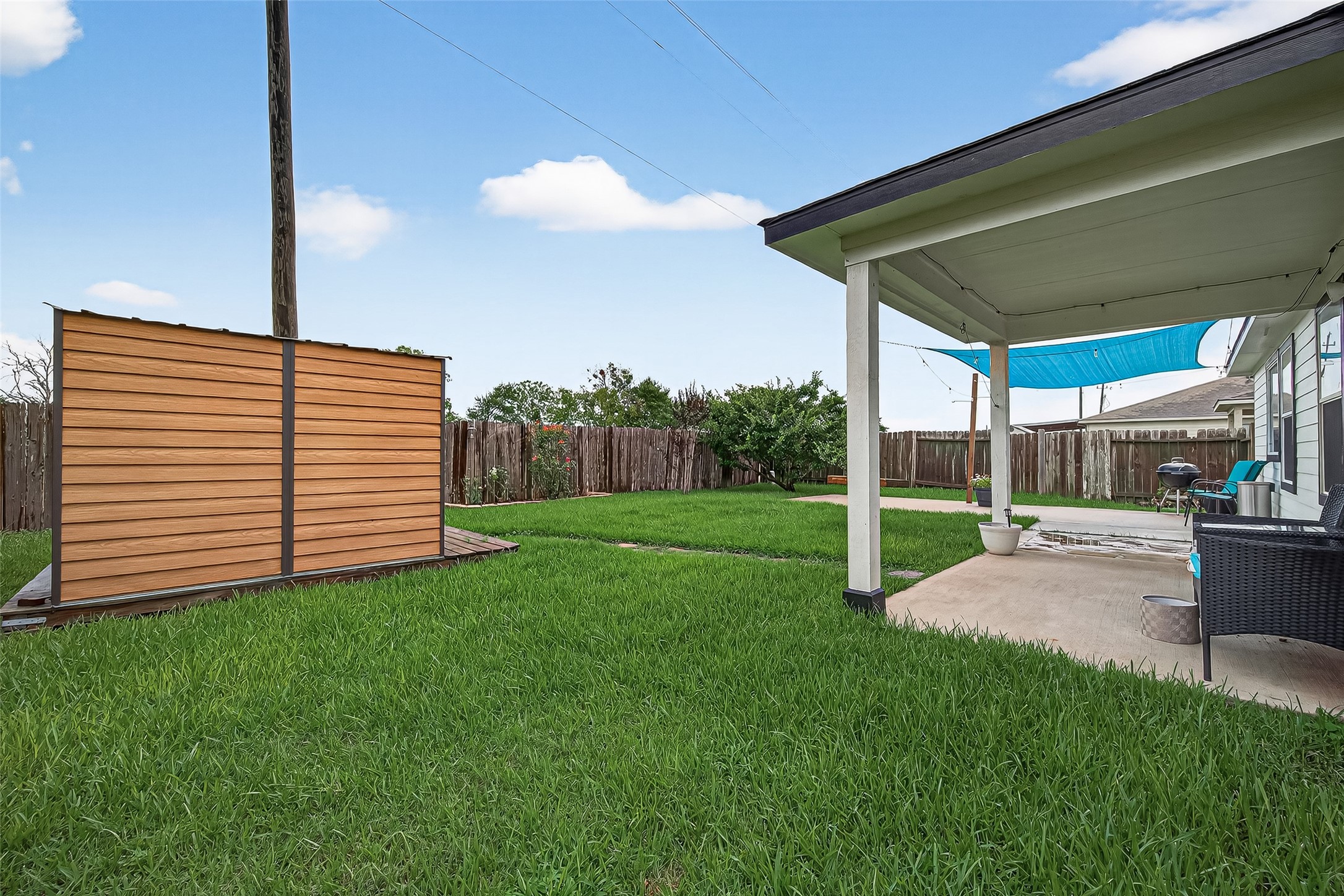919 Wild Cotton Road Rosenberg, TX 77471 - Photo 16 of 20 a view of a porch with a backyard