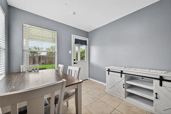 a view of dining room with furniture and window