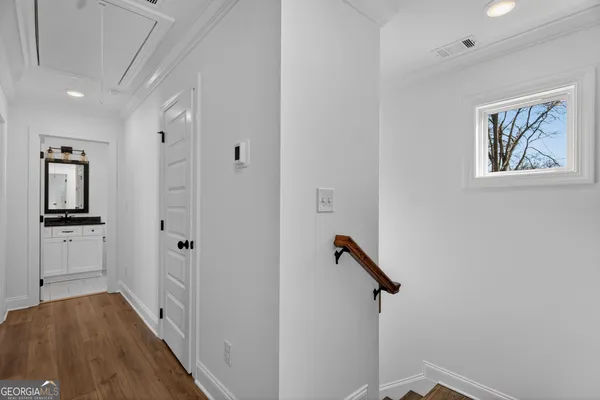 a view of a hallway with a white walls