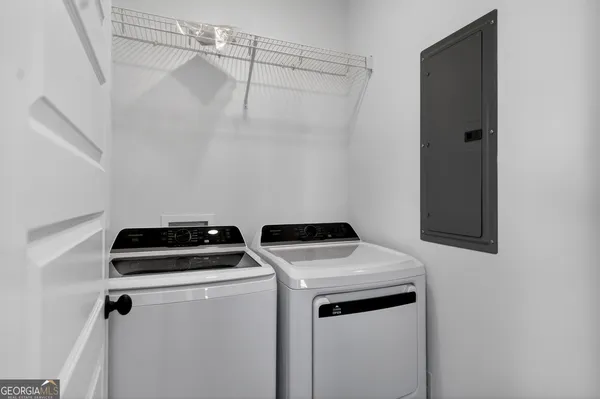 a utility room with dryer and washer