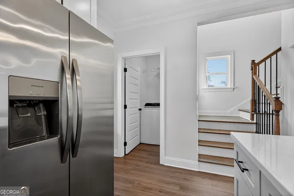 a bathroom with a shower and a sink