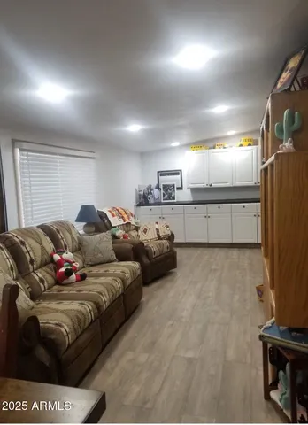 a view of cabinets with wooden floor