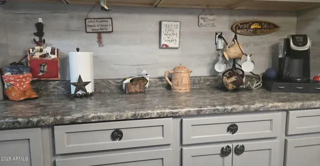 a kitchen with lots of counter space and cabinets
