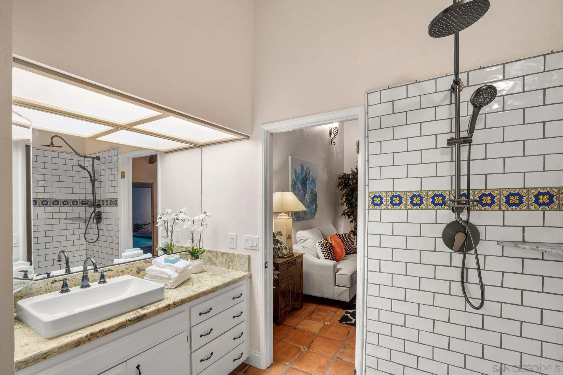 7671 La Brisa Rancho Santa Fe, CA 92067 - Photo 18 of 34 a bathroom with a sink and a mirror