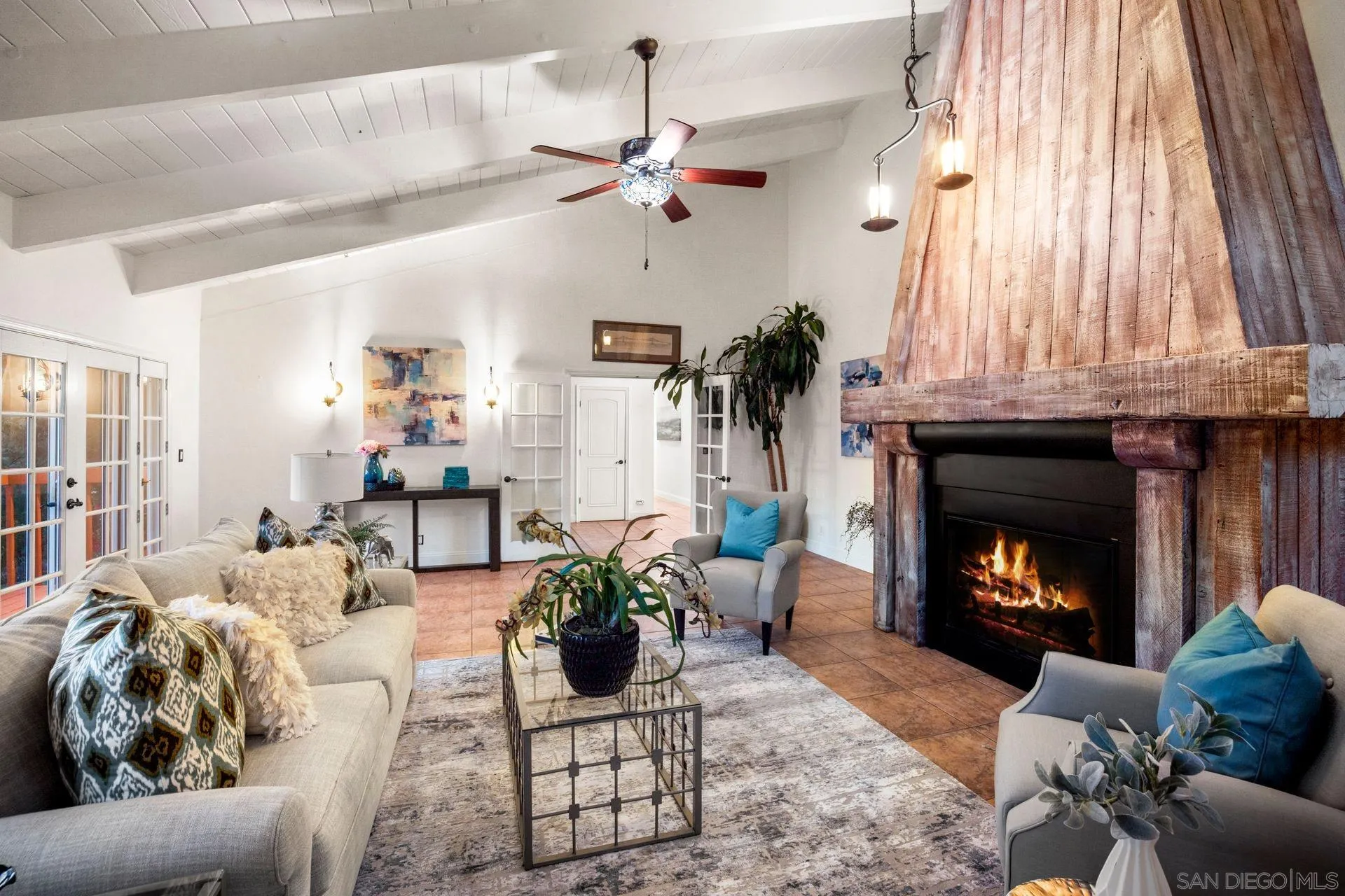 7671 La Brisa Rancho Santa Fe, CA 92067 - Photo 19 of 34 a living room with furniture and a fireplace