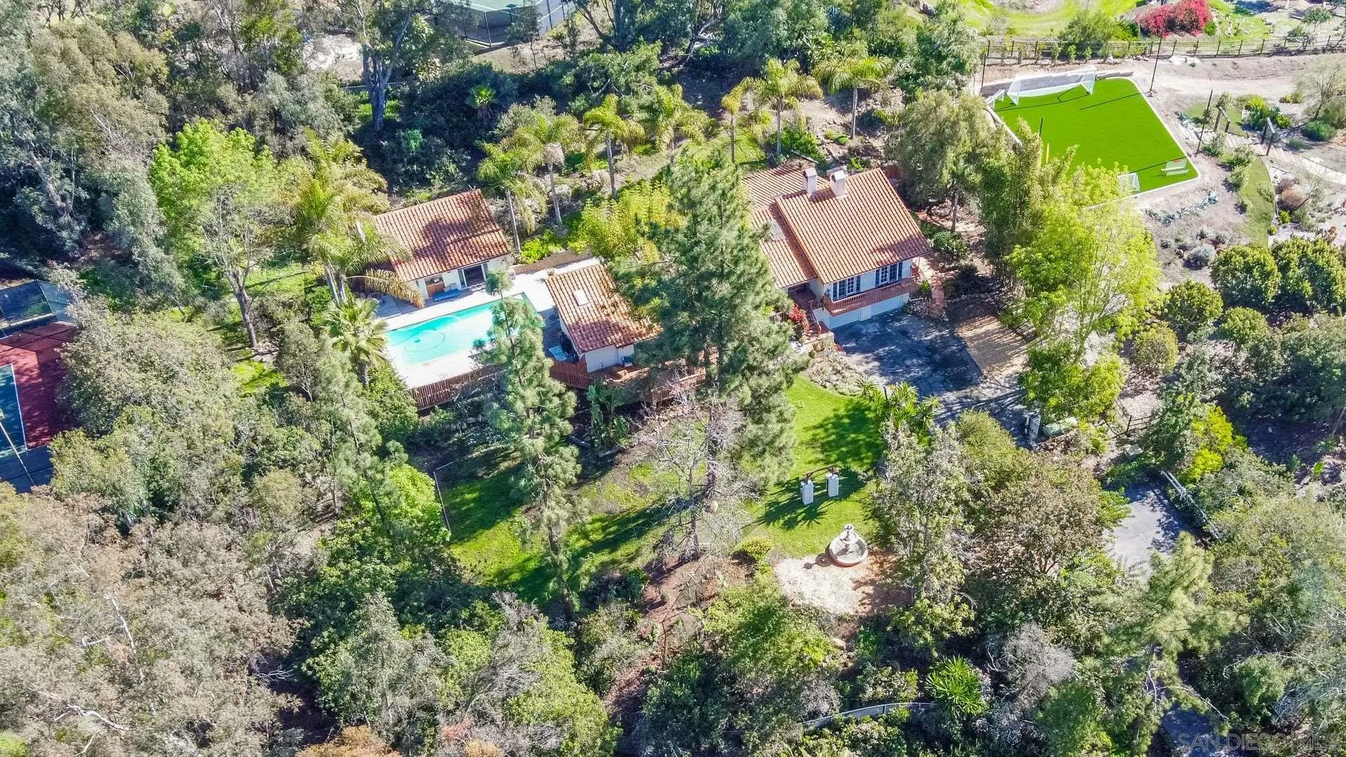 7671 La Brisa Rancho Santa Fe, CA 92067 - Photo 29 of 34 an aerial view of residential house with outdoor space and trees all around