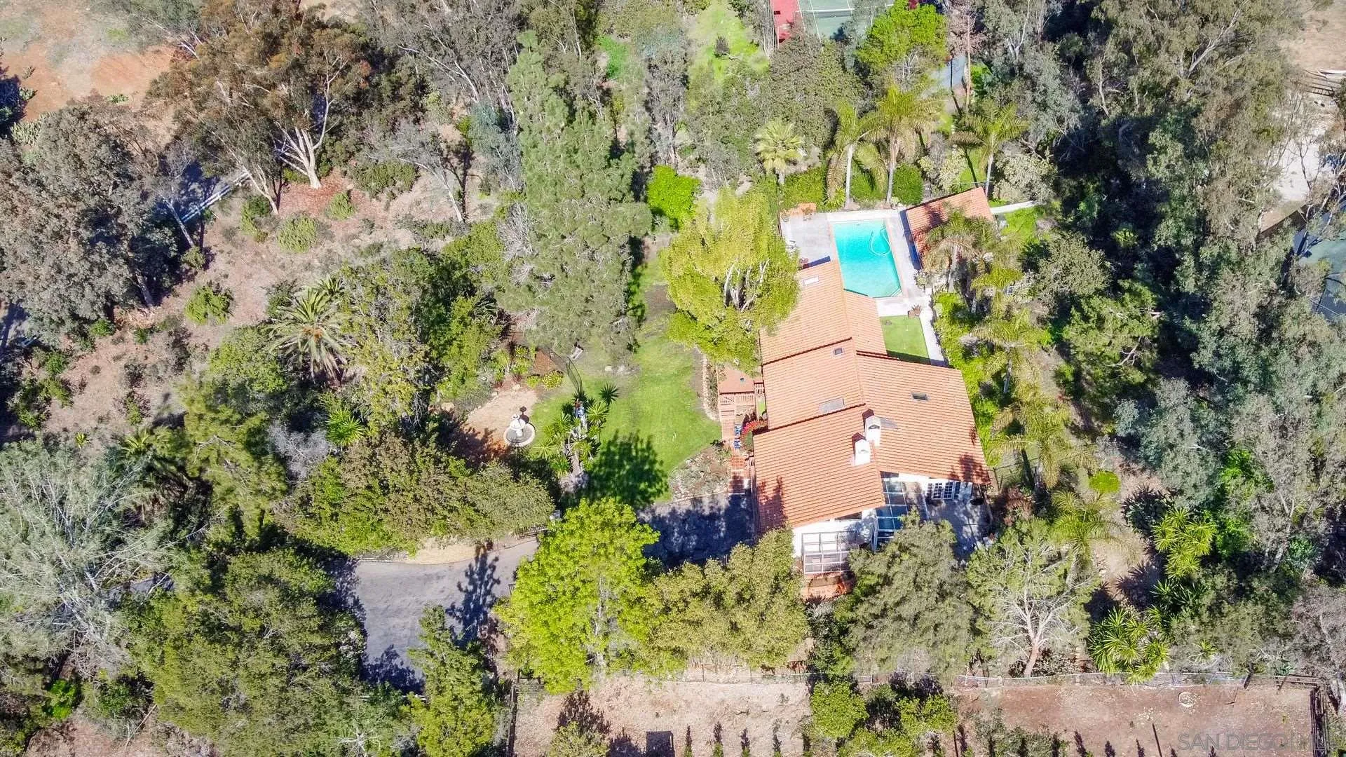 7671 La Brisa Rancho Santa Fe, CA 92067 - Photo 30 of 34 an aerial view of a house with a yard and garden