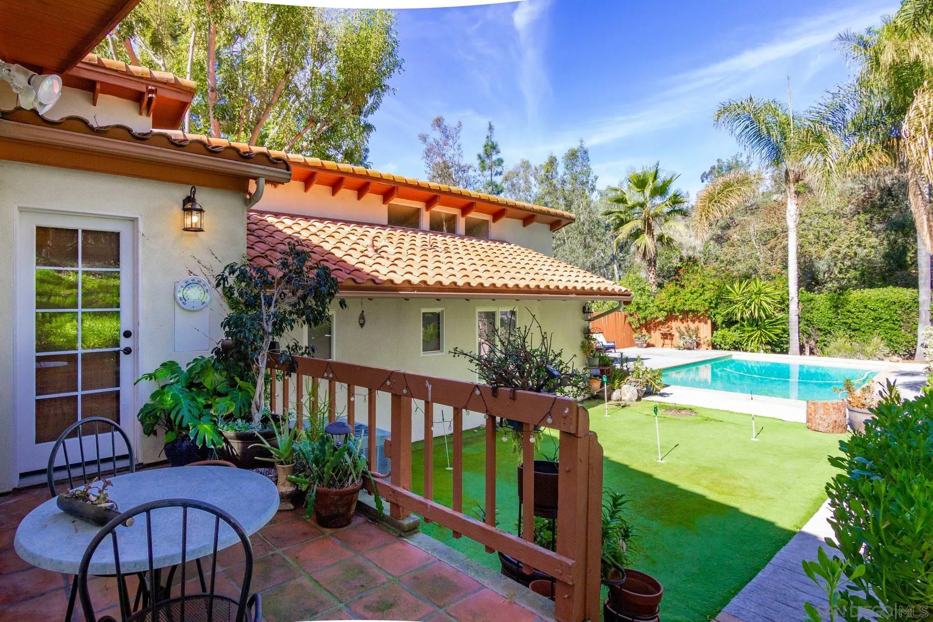 7671 La Brisa Rancho Santa Fe, CA 92067 - Photo 32 of 34 a view of a house with garden and plants