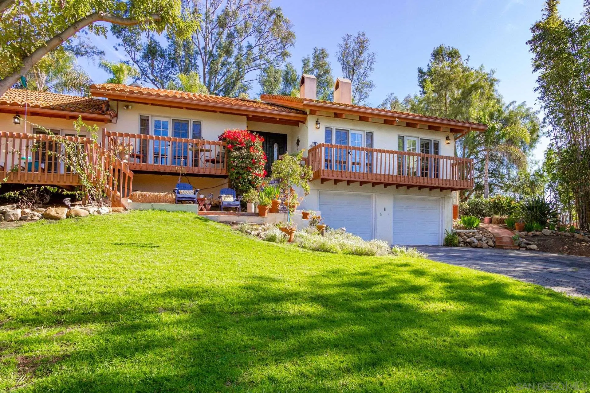 7671 La Brisa Rancho Santa Fe, CA 92067 - Photo 33 of 34 a view of a house with a big yard plants and large trees