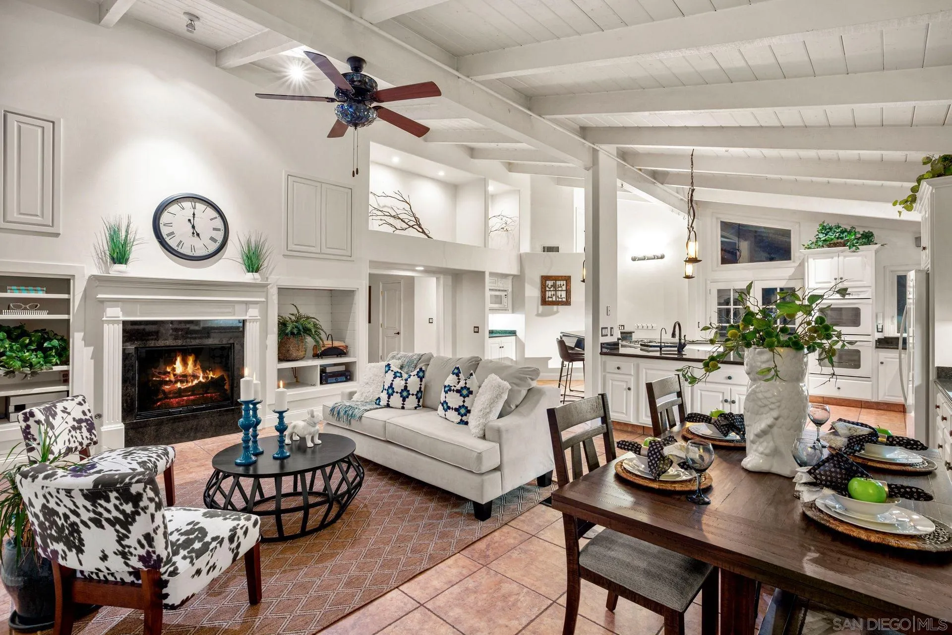 7671 La Brisa Rancho Santa Fe, CA 92067 - Photo 34 of 34 a living room with furniture a fireplace and a large window