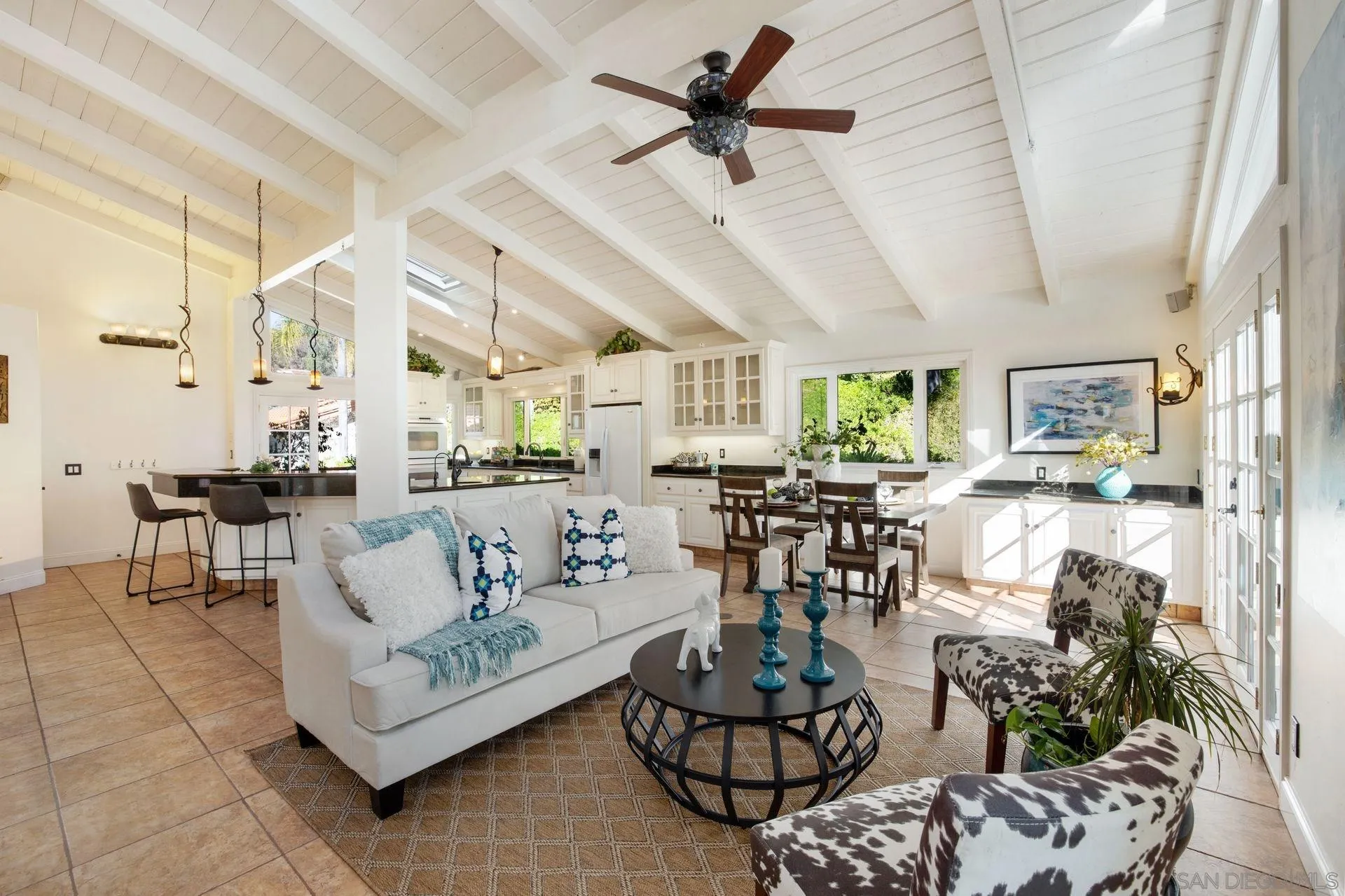 7671 La Brisa Rancho Santa Fe, CA 92067 - Photo 7 of 34 a living room with furniture kitchen view and a chandelier