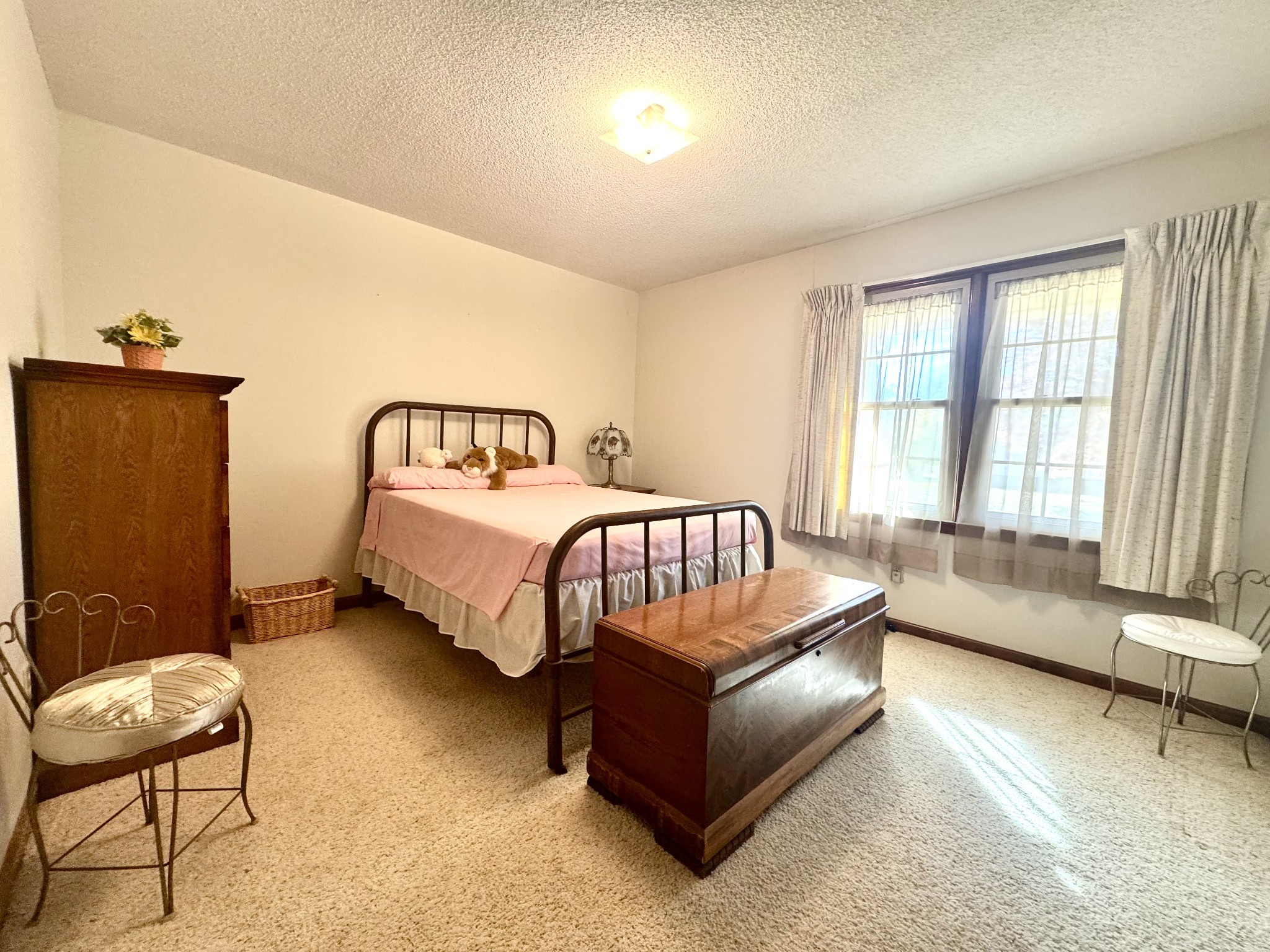 220 Indian Creek Road McEwen, TN 37101 - Photo 20 of 30 a spacious bedroom with a bed a couch and a window