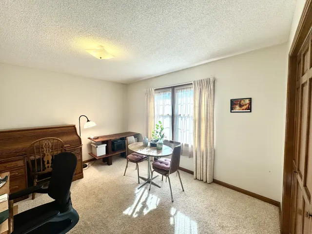 a workspace with furniture and a window