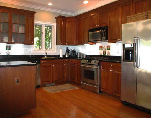27 Home Place, Unit A Greenwich, CT 06830 - Photo 6 of 17 a kitchen with granite countertop stainless steel appliances a sink cabinets and a window