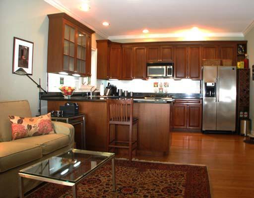 27 Home Place, Unit A Greenwich, CT 06830 - Photo 7 of 17 a kitchen with stainless steel appliances granite countertop a sink wooden cabinets and granite counter tops