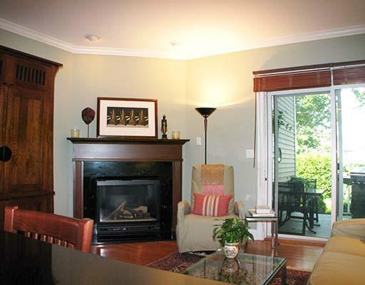 27 Home Place, Unit A Greenwich, CT 06830 - Photo 9 of 17 a living room with furniture a table and a fireplace