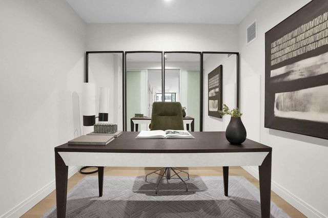 a view of a workspace with furniture