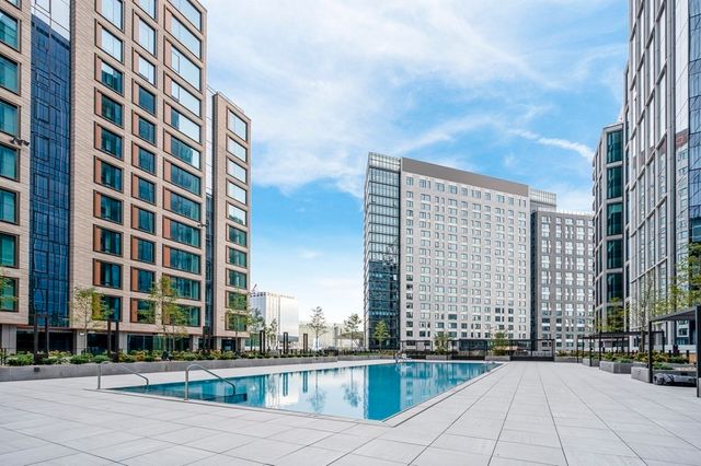 swimming pool view with outdoor seating