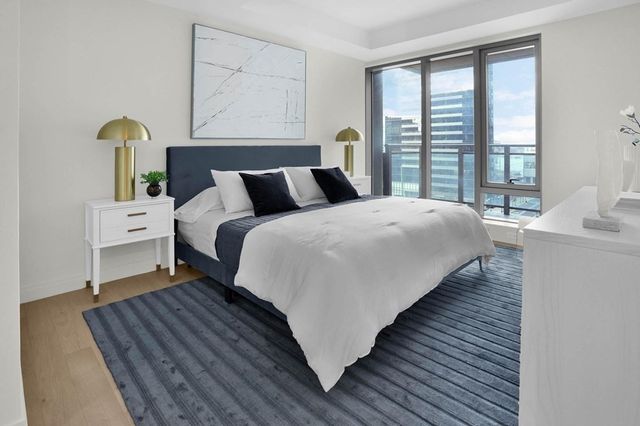 a bedroom with bed and window