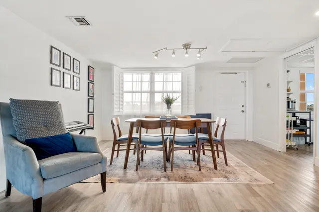 a kitchen with stainless steel appliances a refrigerator sink and cabinets