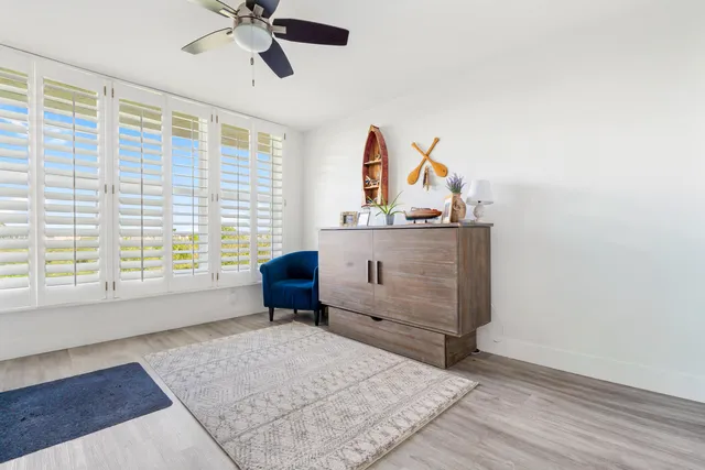 a view of a livingroom with furniture and cabinet