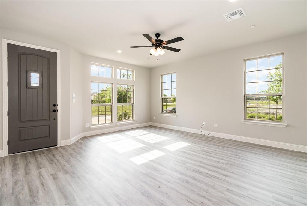 3621 Geoffrey Trail Rowlett, TX 75088 - Photo 11 of 12 a view of an empty room with a window and wooden floor