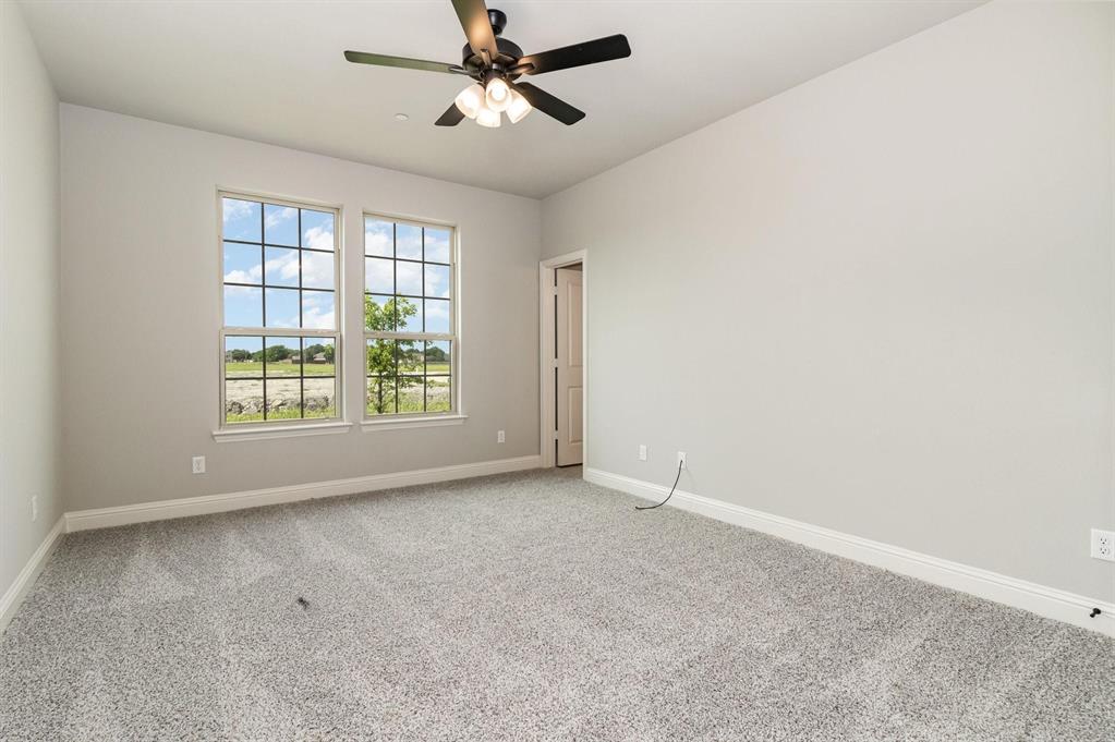 3621 Geoffrey Trail Rowlett, TX 75088 - Photo 6 of 12 an empty room with windows and fan