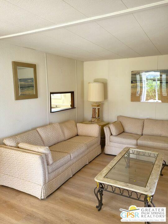 69430 Fairway Road Desert Hot Springs, CA 92241 - Photo 10 of 19 a living room with a couch and a night stand