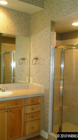 4890 Turning Leaf Way Reno, NV 89519 - Photo 9 of 9 a bathroom with a shower and a sink