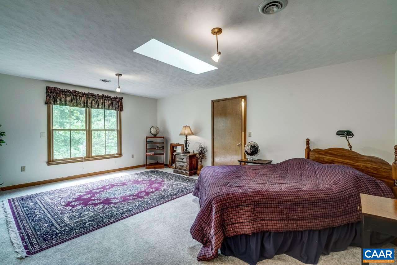 1531 Riding Club Road Keene, VA 22946 - Photo 21 of 27 Gigantic walk-in closet with carpeted floor could almost be a playroom for a child.
