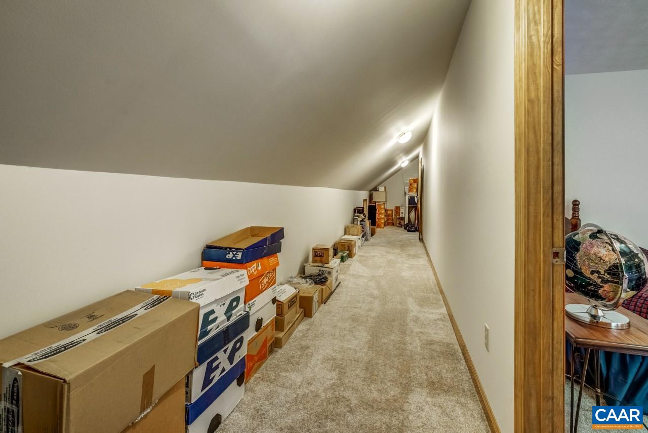 1531 Riding Club Road Keene, VA 22946 - Photo 22 of 27 In addition to each upstairs bedroom having huge closets, they share access to this storage room. Imagine this as a kids' hideaway, too!