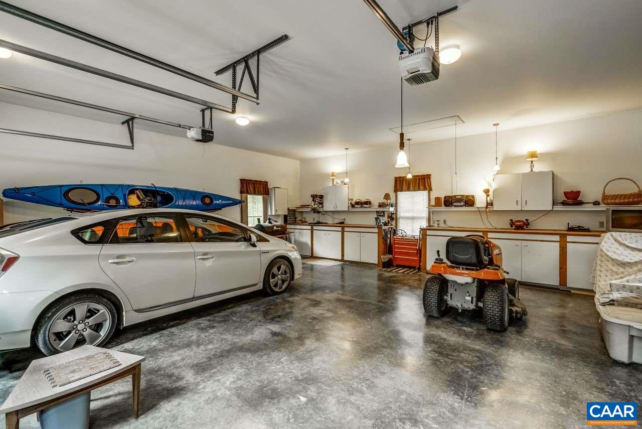 1531 Riding Club Road Keene, VA 22946 - Photo 25 of 27 Oversized floor space and doors allow for large vehicle parking while still having plenty of room for storage and workshop. Enclosed breezeway connects to the kitchen.