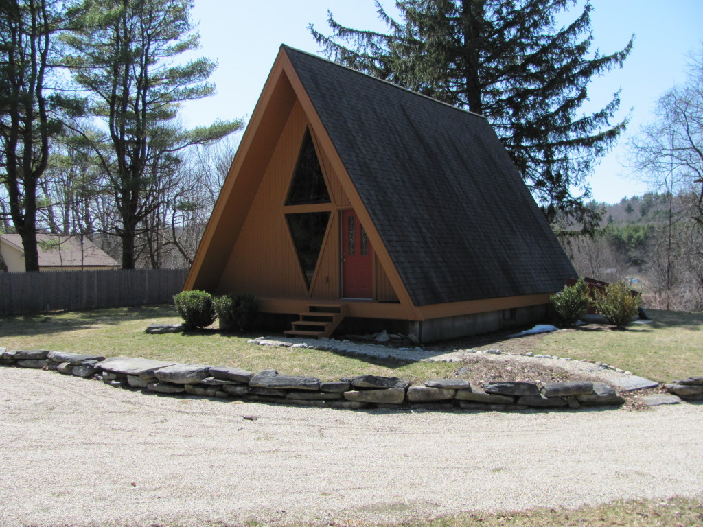 a view of house and a yard