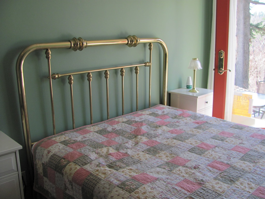 1525 North Main Road Otis, MA 01253 - Photo 11 of 13 a bedroom with a bed and a mirror