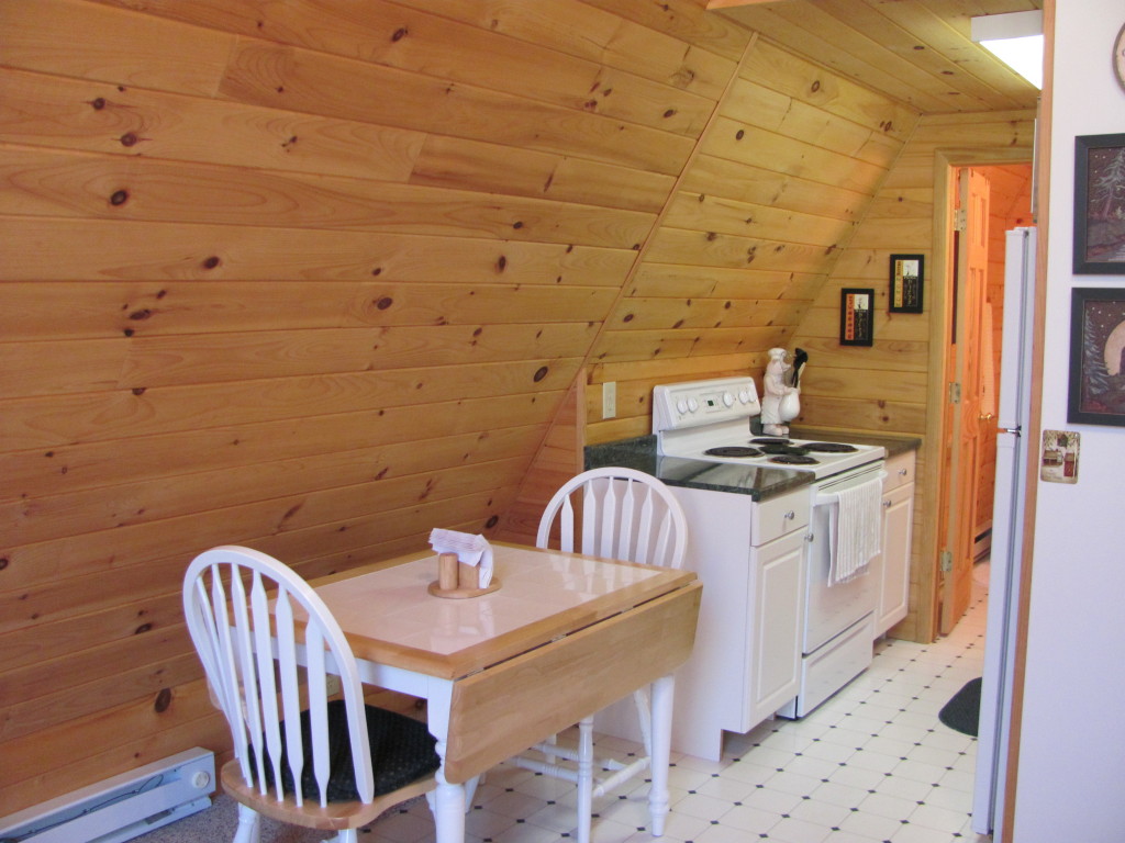 1525 North Main Road Otis, MA 01253 - Photo 13 of 13 a kitchen with a sink and wooden floor