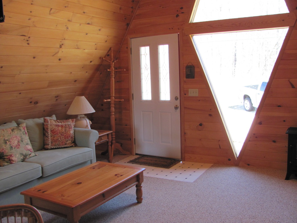 1525 North Main Road Otis, MA 01253 - Photo 3 of 13 a living room with furniture and a rug