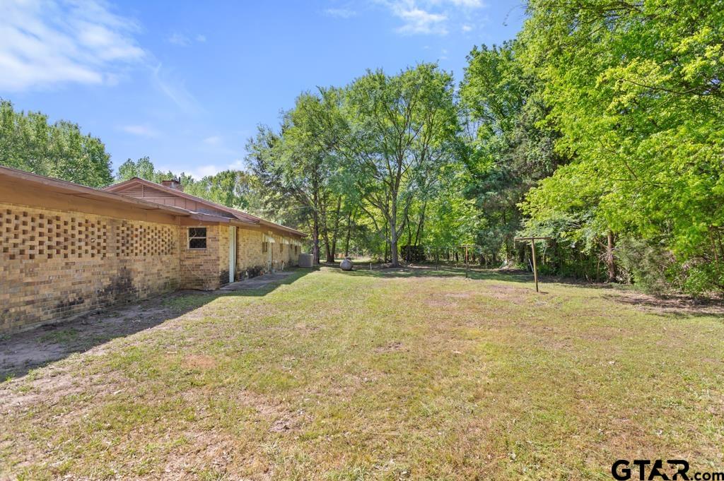 3549 Fm 69 Quitman, TX 75783 - Photo 11 of 32 a backyard of a house