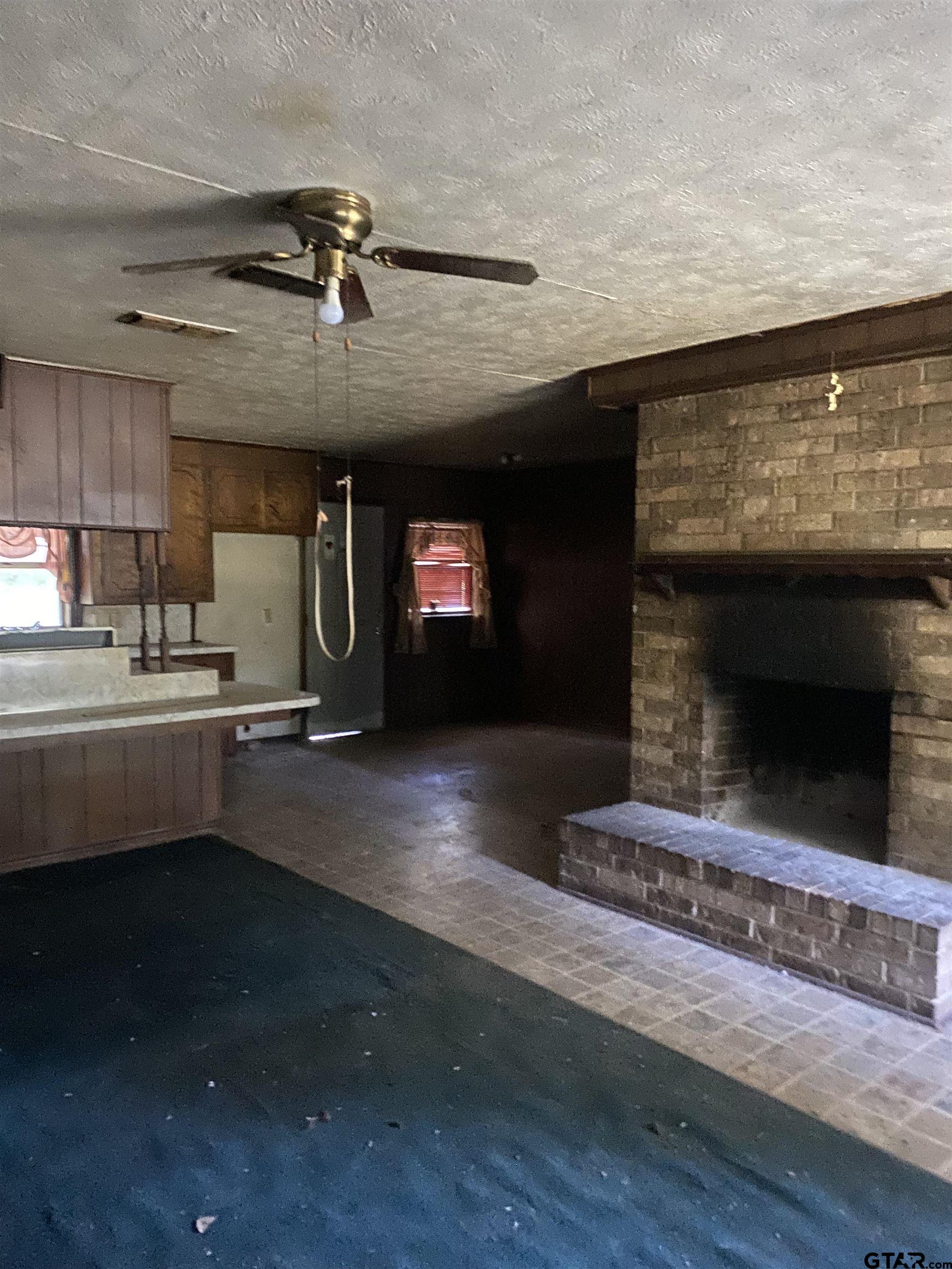 3549 Fm 69 Quitman, TX 75783 - Photo 6 of 32 a kitchen with counter top space and a fireplace