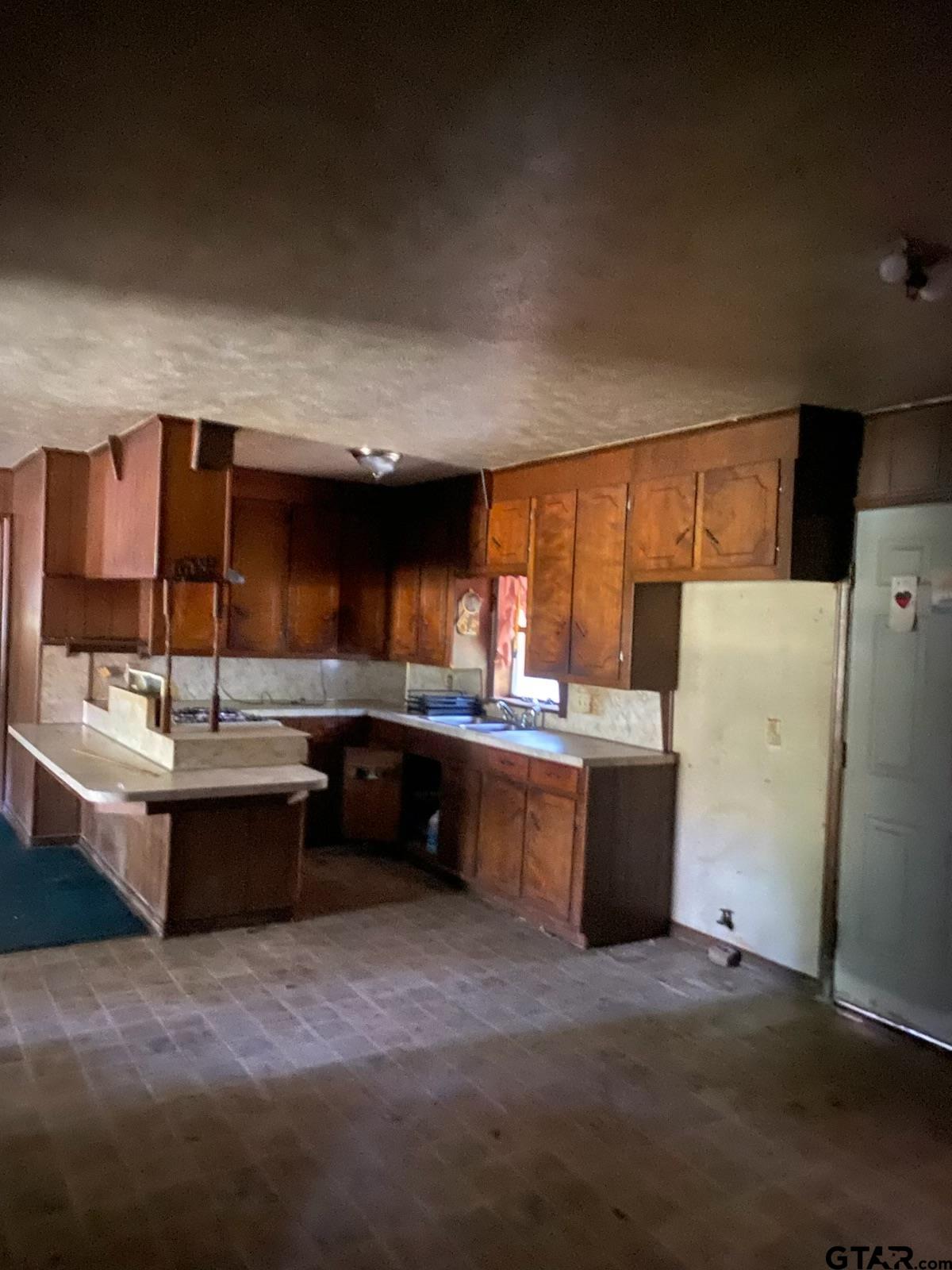 3549 Fm 69 Quitman, TX 75783 - Photo 7 of 32 a kitchen with refrigerator and window
