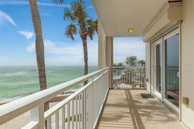 a view of balcony with furniture