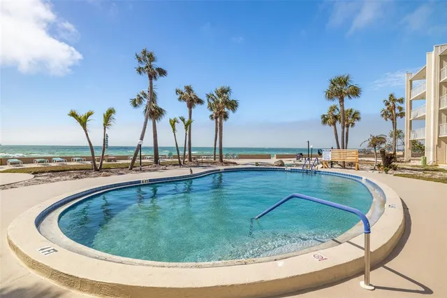 a view of a swimming pool with a lake