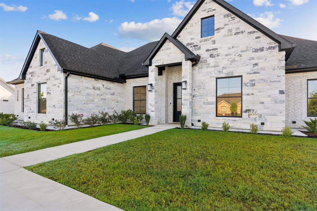 8008 Ben Day Murrin Road Fort Worth, TX 76126 - Photo 2 of 40 a front view of a house with a yard