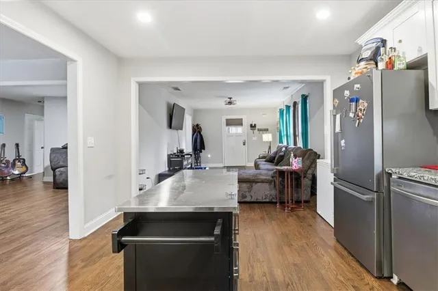a view of a living room and a wooden floor