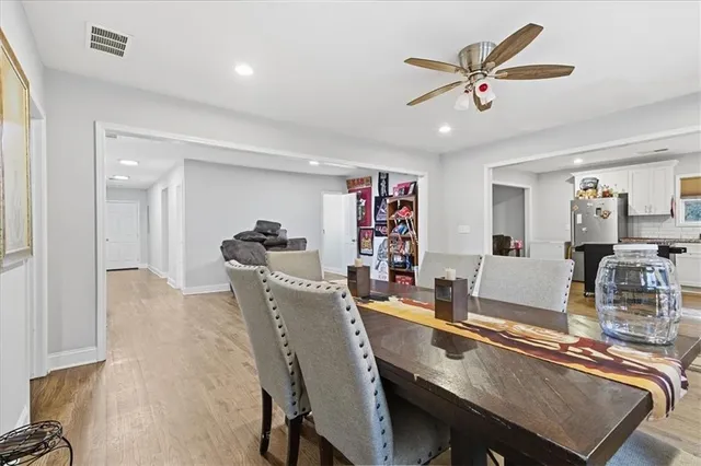 a dining room with furniture and window