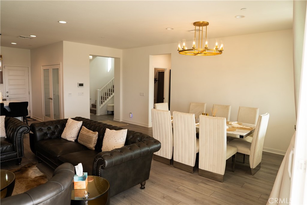 35227 Vernon Drive Beaumont, CA 92223 - Photo 12 of 49 a living room with furniture and a chandelier