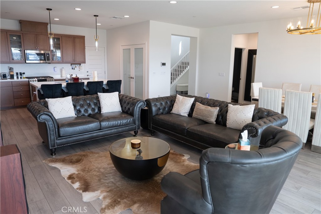 35227 Vernon Drive Beaumont, CA 92223 - Photo 15 of 49 a living room with furniture and a view of kitchen