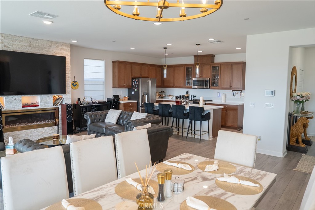 35227 Vernon Drive Beaumont, CA 92223 - Photo 16 of 49 a living room with stainless steel appliances furniture a rug and a kitchen view