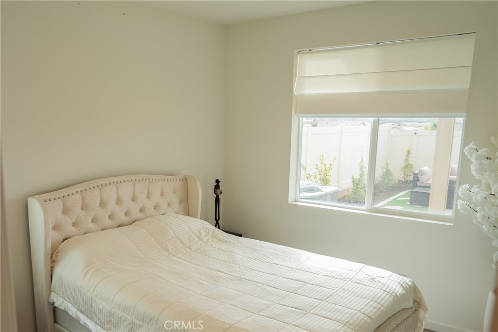 35227 Vernon Drive Beaumont, CA 92223 - Photo 20 of 49 a bedroom with a bed and a window