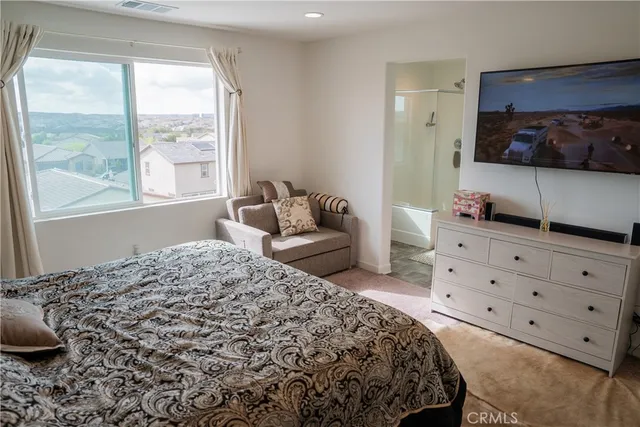 a bedroom with a bed and window